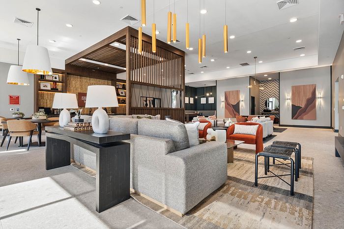 Interior clubhouse with lounge seating, ceiling lights