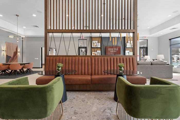Interior clubhouse with lounge seating, ceiling lights