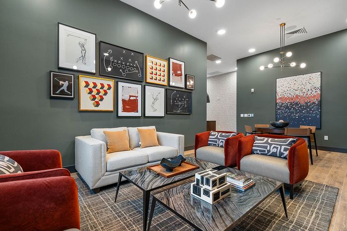 Interior clubhouse with lounge seating, ceiling lights
