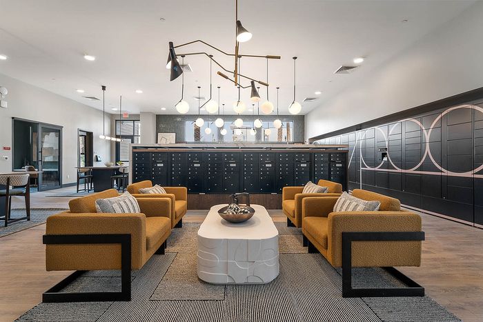 Interior mail room with seating, ceiling lights