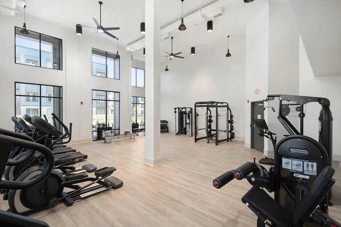 A fitness center with fitness equipment at The Hickory at Indian Lake Village apartments in Sumner County, TN.