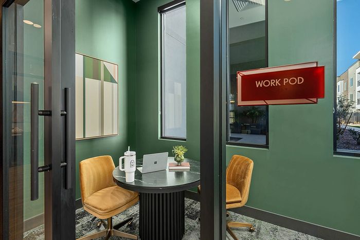 Navona interior work pod, wall decor, ceiling lighting, large windows