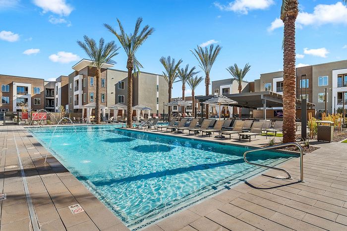 Navona exterior pool, outdoor lounge seating, outdoor umbellas