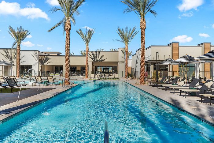 Navona exterior pool, outdoor lounge seating, outdoor umbellas