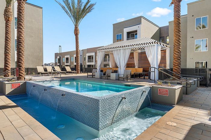 Navona exterior pool, outdoor lounge seating, outdoor umbellas