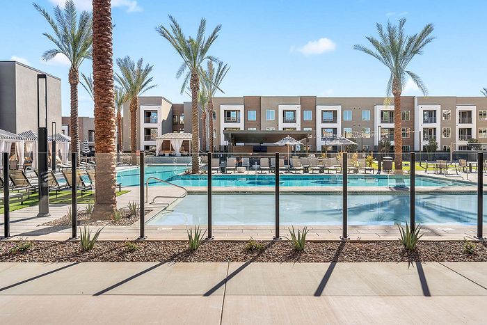 Navona exterior Expansive pool deck with wading pool, outdoor lounge seating