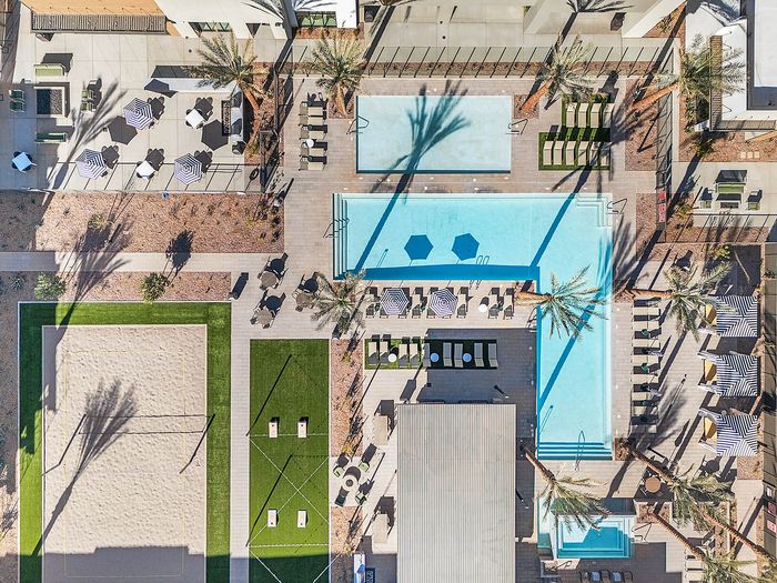 Navona exterior bird's-eye view pool, volleyball court, bbq grills, outdoor entertainment