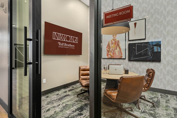Navona interior meeting room, wall decor, ceiling lighting, large windows
