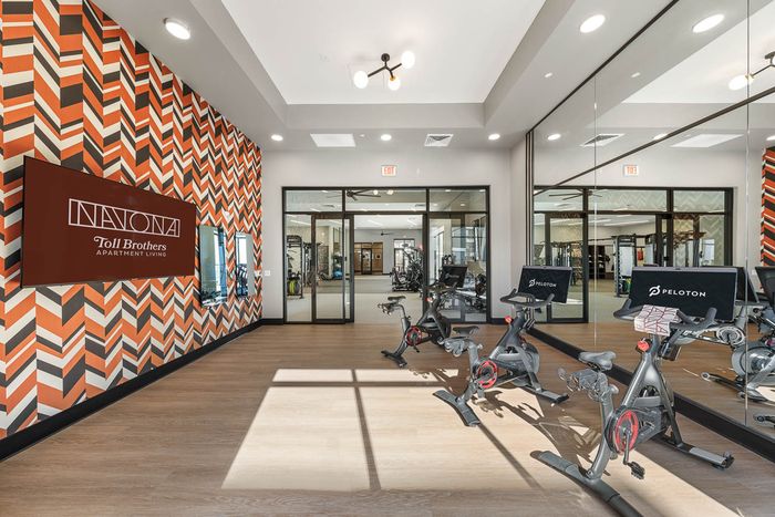Navona interior fitness center bike room, large, mirrors, ceiling lighting, mounted flat screen tv