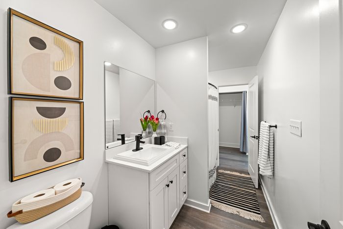 Bathroom with one sink and mirror above