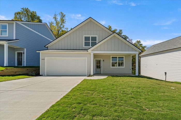 Exterior of home in the daylight with 2 car garage, Roberta Home