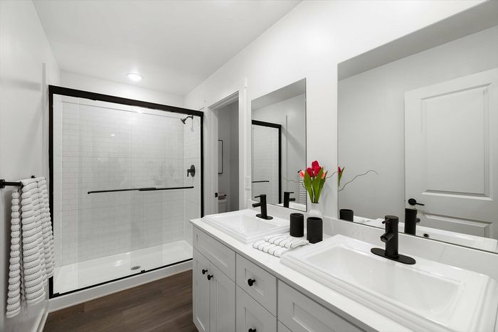 Bathroom with walk-in shower and double vanity