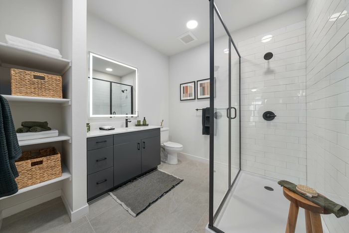 Navona bathroom, tile floors, ceiling lighting, walk-in shower