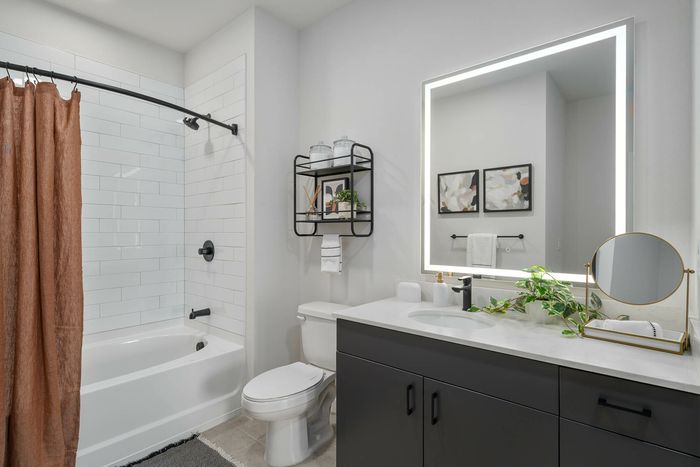 Navona bathroom, shower and tub, ceiling lighting, tile floors