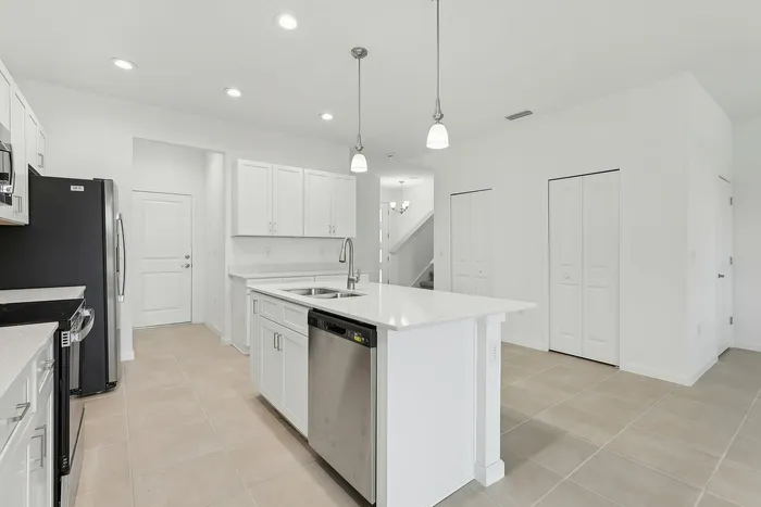 Open Concept Kitchen with eat in island and stainless steel appliances