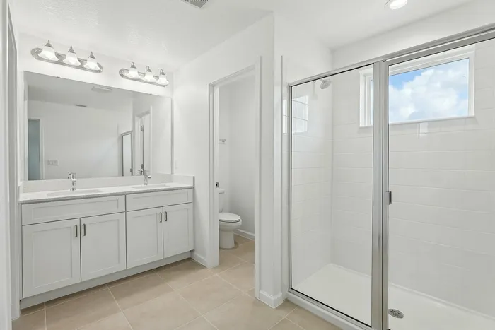 Main Bathroom with Glass Walk In Shower and Double Vanity