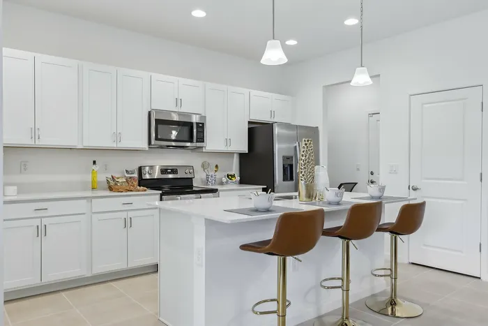 Open Concept Kitchen with eat in island and stainless steel appliances