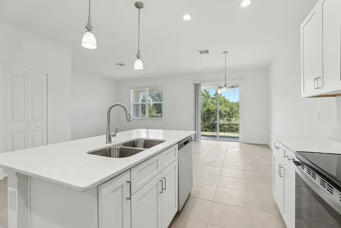 Open Concept Kitchen with eat in island and stainless steel appliances