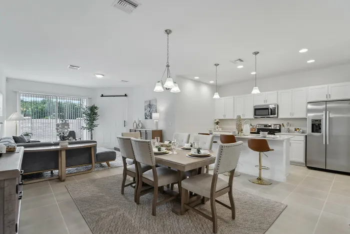 Open Concept Kitchen with eat in island and stainless steel appliances