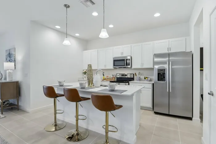 Open Concept Kitchen with eat in island and stainless steel appliances