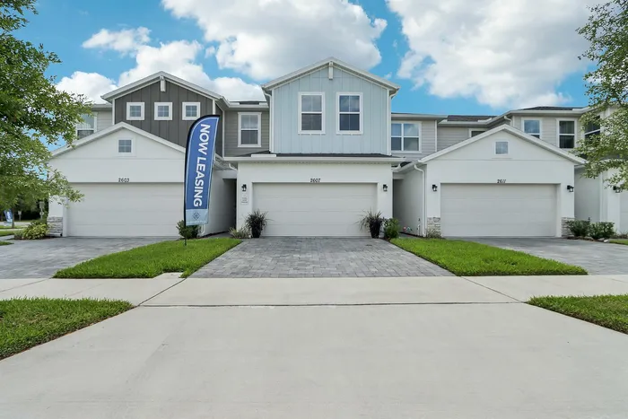 Exterior Townhome with two-car garage and paved driveway