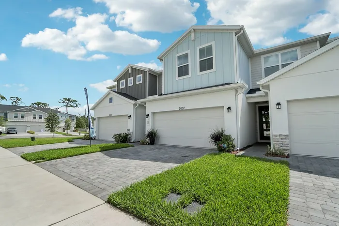 Exterior Townhome with two-car garage and paved driveway