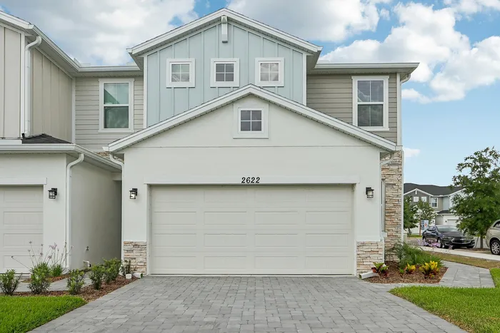 Exterior Townhome with two-car garage and paved driveway