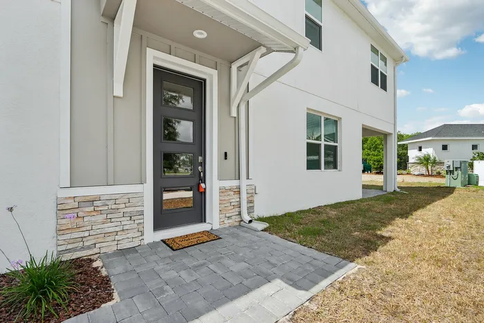Side entrance into townhome with covered entrance