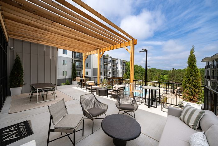 Outdoor terrace overlooking community pool at Ava Oakwood