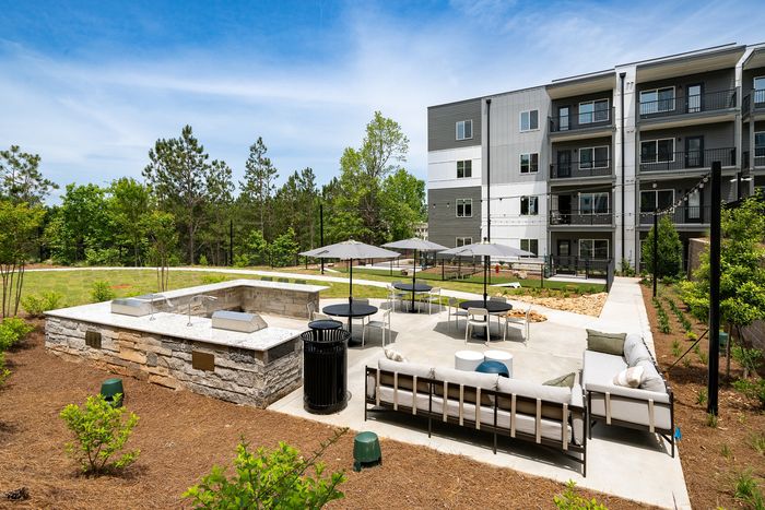 Outdoor grills and seating at Ava Oakwood in Gaiinesville