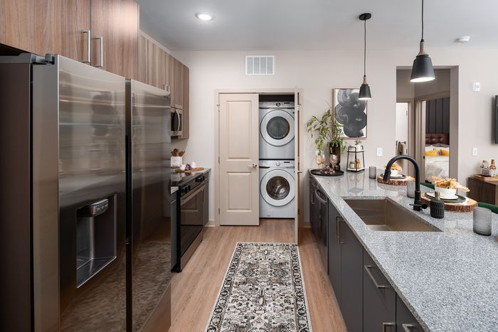 Ava Oakwood luxury apartment kitchen with in unit laundry in Gainesville