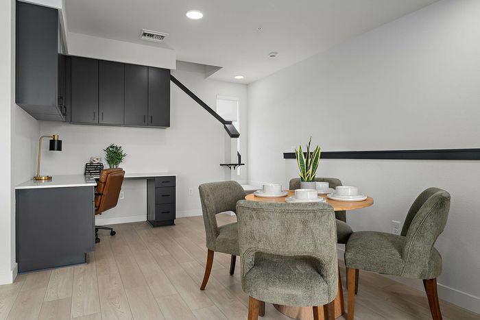 Navona interior space with cabinet space, hardwood floors, ceiling lighting
