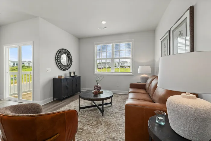 Townhouse rental in Burlington with furnished living room and arcadia door at Spire at Darrowby Ridge.
