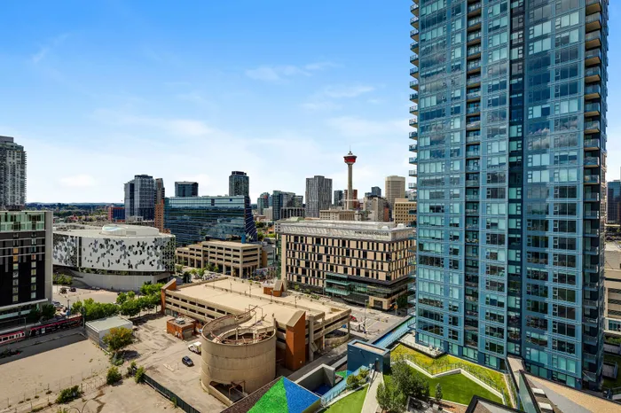 Breathtaking cityscape view from a high-rise apartment, featuring modern architecture and bustling urban life below.