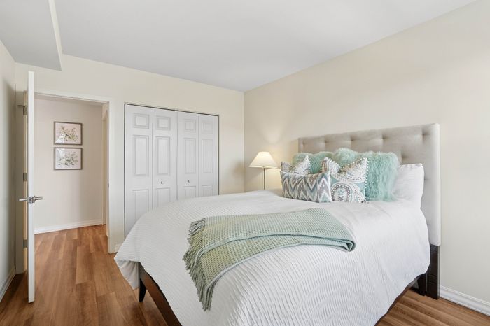 Inviting bedroom with a plush bed, elegant pillows, and stylish decor creating a serene ambiance.