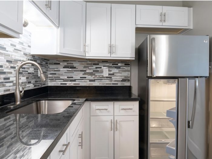Modern, Renovated Kitchen featuring Stainless Steel appliances, breakfast bar and plenty of counter space and cabinets a cook's dream Select Units Only