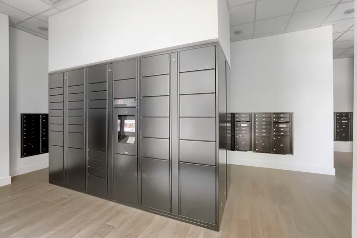 Garrett Uptown resident mailroom with Parcel Pending smart package lockers and individual mailboxes in Chandler, AZ