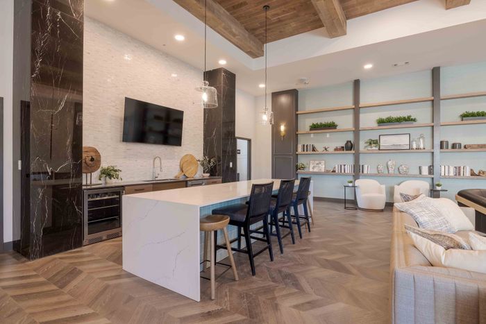 Demonstration kitchen with island seating in the Garrett Parker clubhouse
