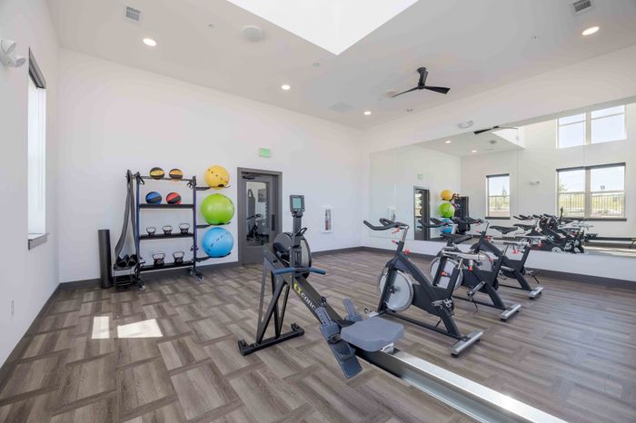 Cycling bikes and rowing machine in the Garrett Parker yoga and cycling studio