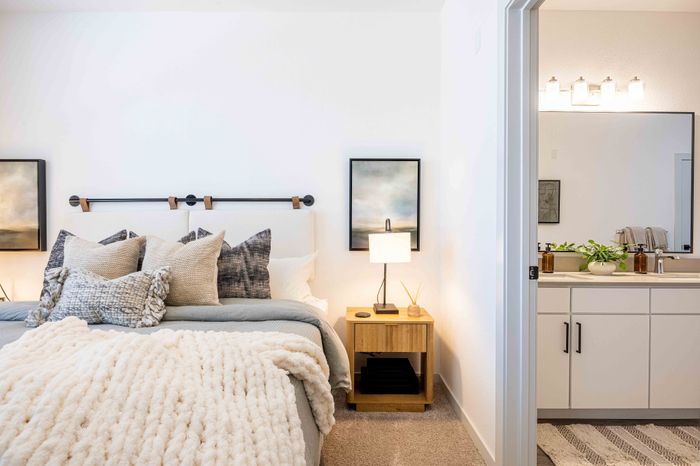 Primary bedroom with view into en suite bathroom in the Garrett Parker B1 floor plan