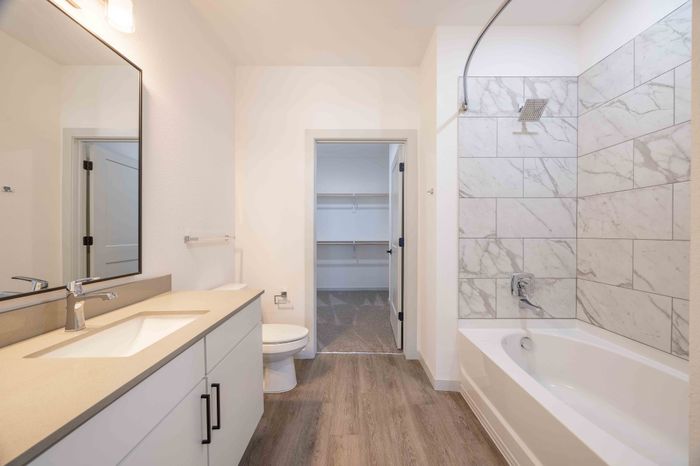 Bathroom with soaking tub and walk-in closet view in the Garrett Parker A1 floor plan