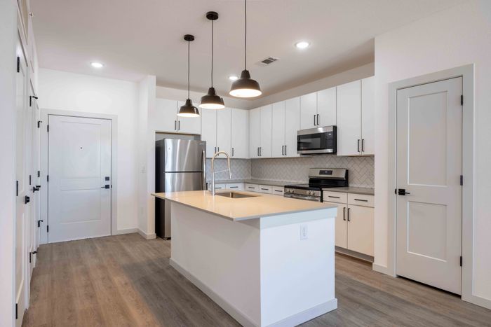 Kitchen with island seating in the Garrett Parker A1 floor plan