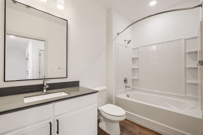 Second bathroom in a B2 two-bedroom at Garrett North Powers with a single vanity and tub and shower combination
