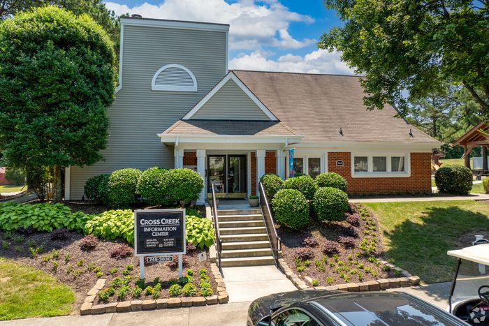 Welcoming information center with a brick facade and manicured landscaping.