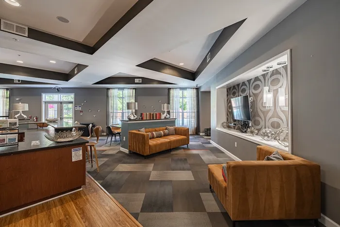 Contemporary lounge area with stylish decor, plush sofas, and modern lighting, perfect for relaxation and social gatherings.