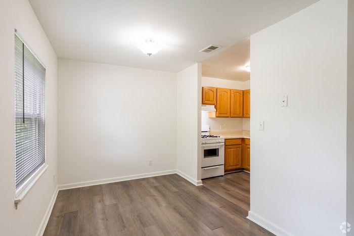 Bright and inviting kitchen space with modern wood cabinetry and sleek flooring, perfect for culinary inspiration.