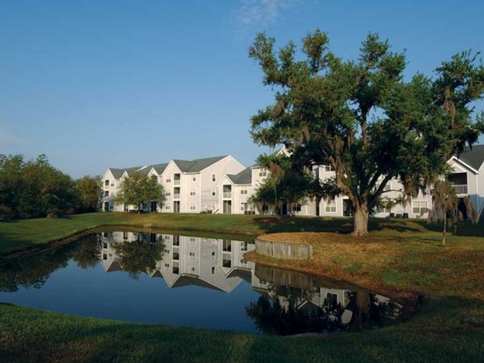 Residential buildings near lake | The Gables at Lakeside Kissimmee, FL