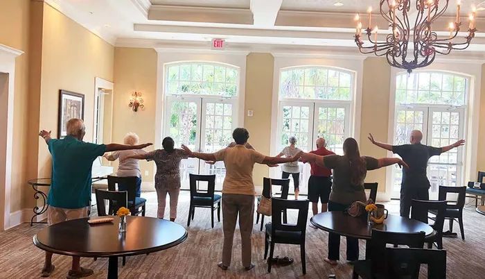 Seniors doing group exercise Sandalwood Village | Naples FL