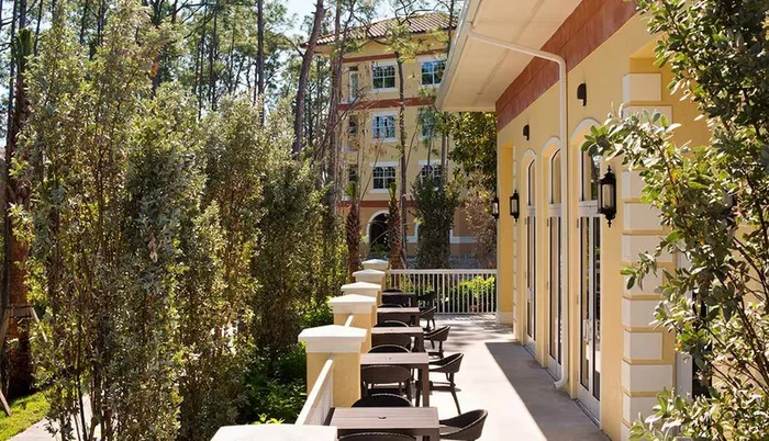 Exterior of a building with patio Sandalwood Village | Naples FL