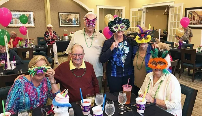 Group enjoying a masked party Sandalwood Village | Naples FL